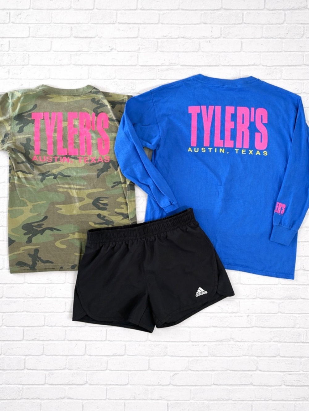 Tyler’s lot of shirts and pair of shorts